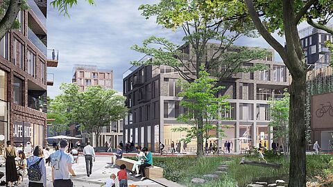 Impressie van van een pleintje met groen en gebouwen erom heen